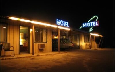 neon sign outside a motel