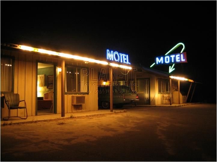 neon sign outside a motel